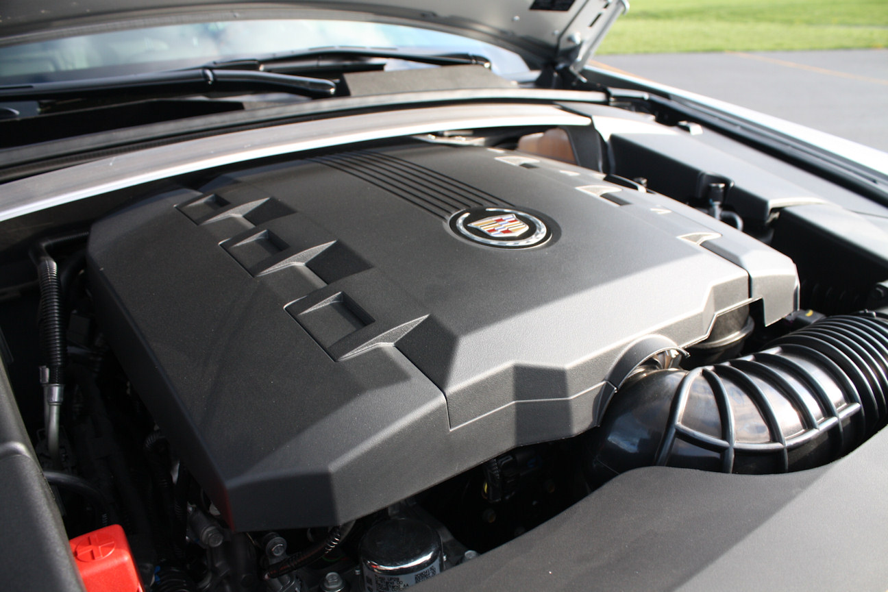  the hood to reveal an acre of black plastic. Note how the 4.2L V8 Audi 